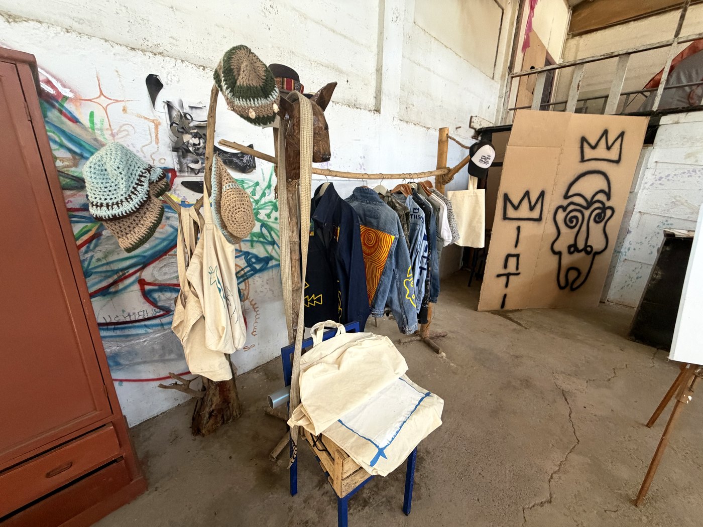 A rack of Inti's hand-painted clothing