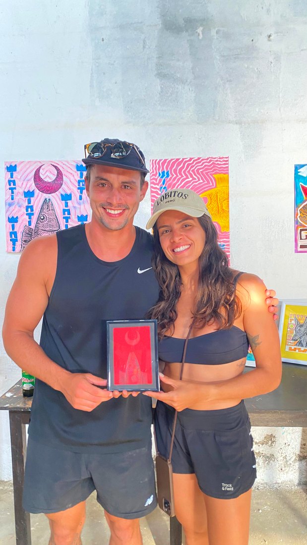 A couple with a small painting