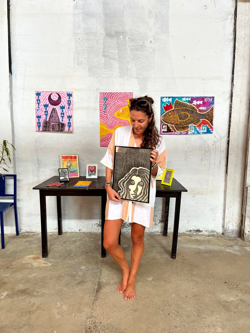 A guest with a framed piece